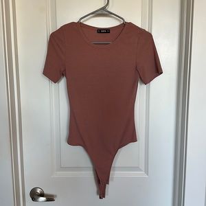 Pink short sleeve body suit